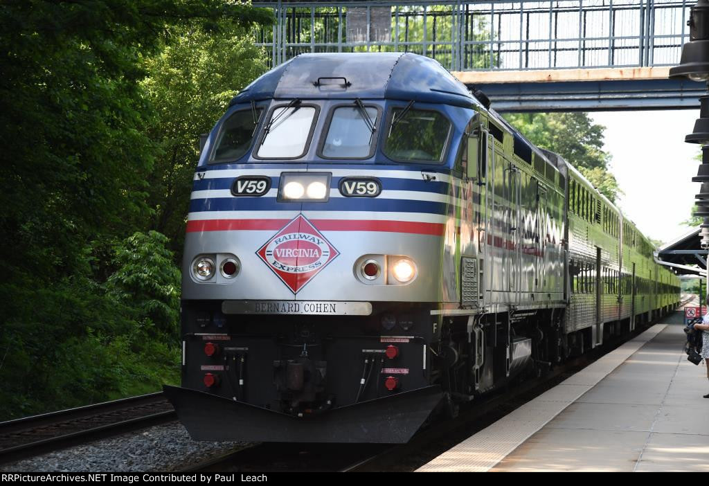 Outbound commuter makes its station stop